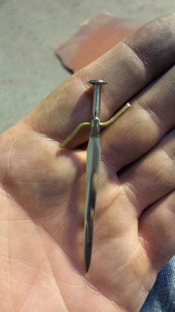 Ingenious Tiny Swords Made From Nails (37 photos)