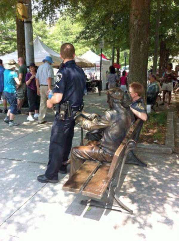 people having fun with statues 19