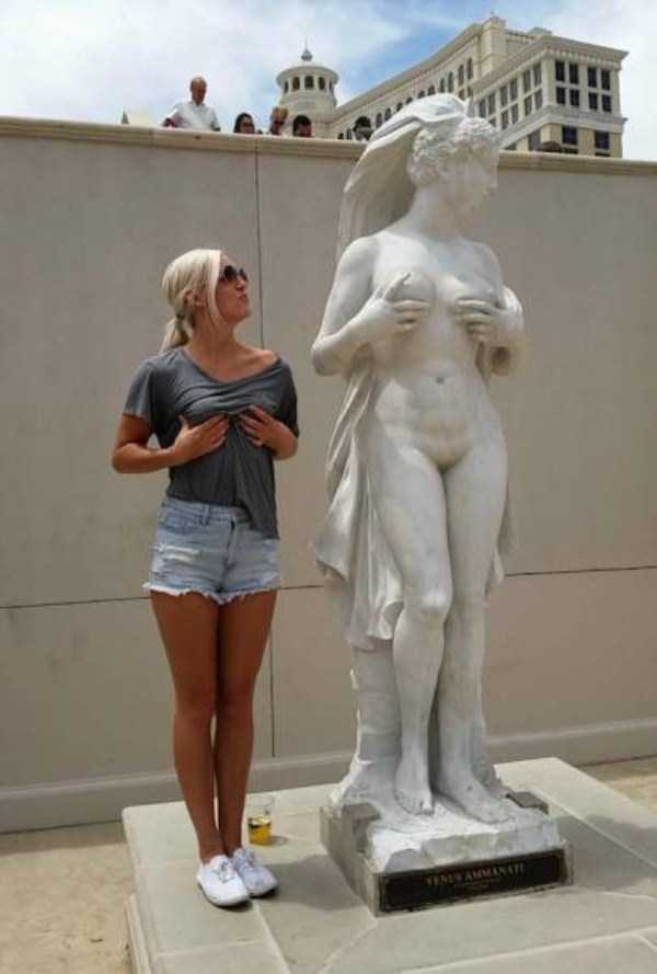people having fun with statues 22