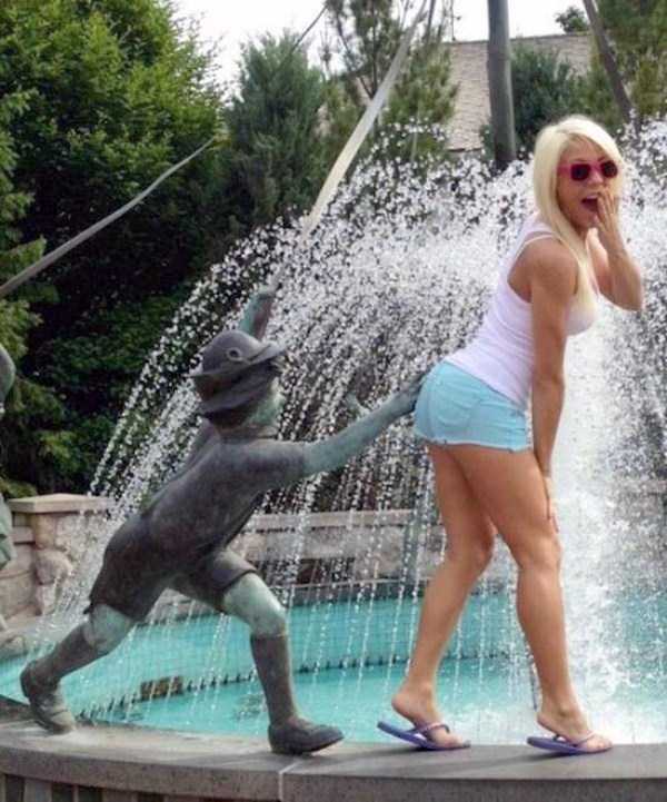 people having fun with statues 17
