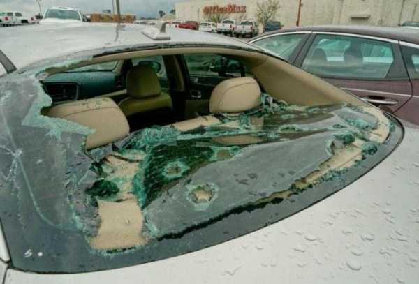 hail storm damaged cars on dealership lot